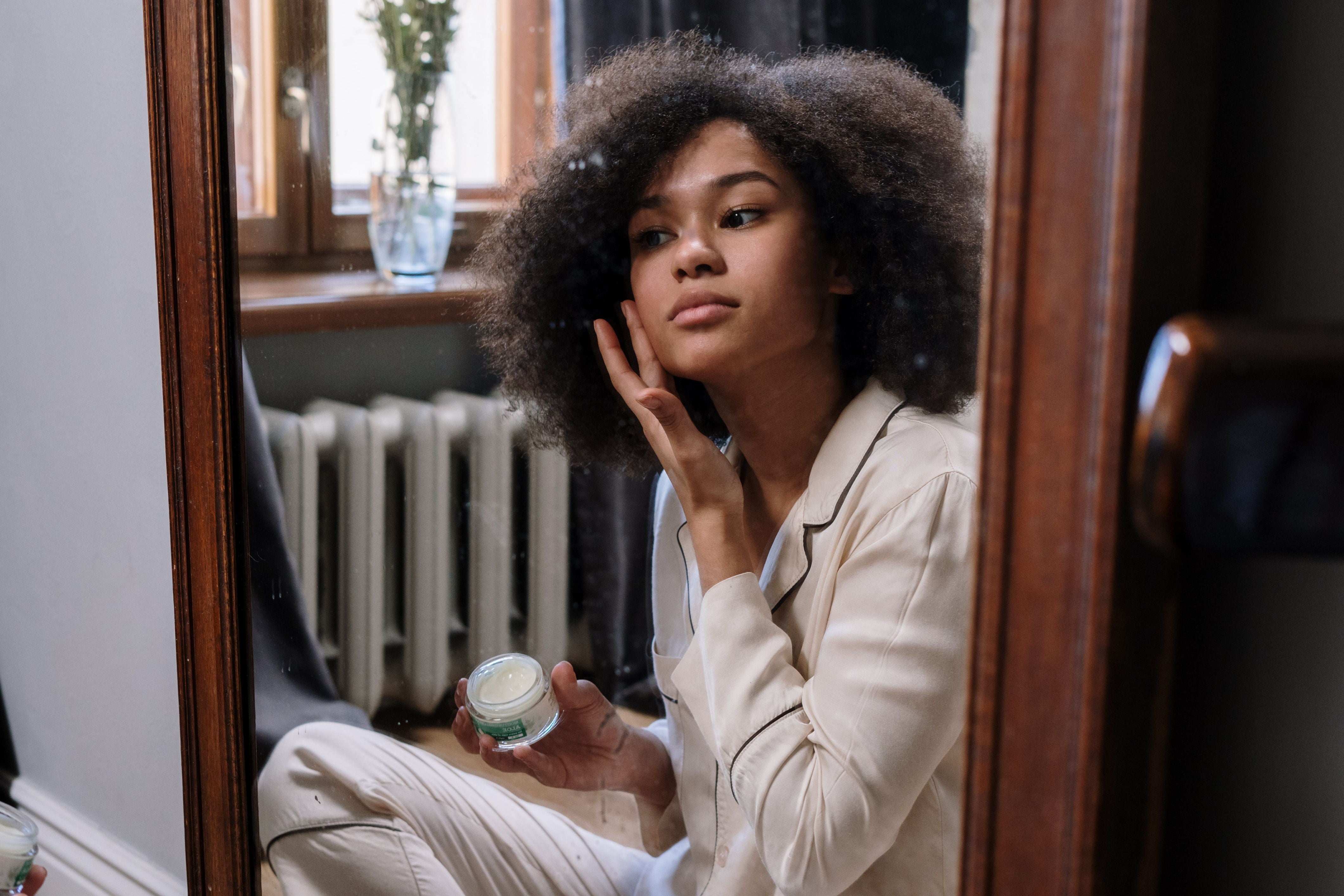 Girl Applying Batana Oil