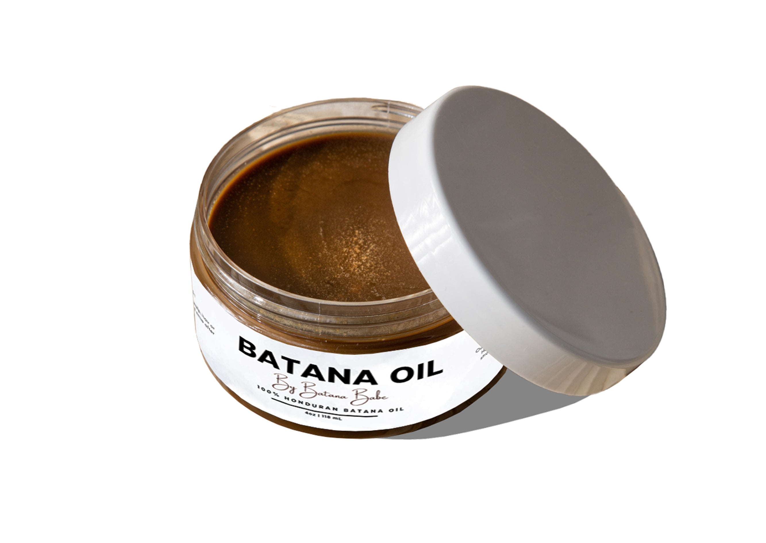 This is a closer view of our batana oil jar. Each jar is sealed and hand poured. 