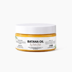 A jar of By Batana Bake Banana Oil hair mask on a clean white background. The product features a white lid and a clear jar showing the golden-yellow oil inside, with a white label displaying the brand name and product details.